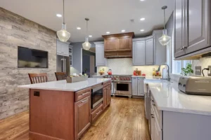 Expert kitchen cabinet installation with modern hardware during a complete home renovation project