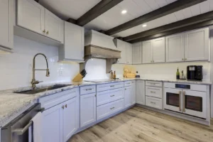 A high-quality cabinetry display from the kitchen cabinets in Lancaster PA expert guide, showing both natural wood installation and modern refacing options