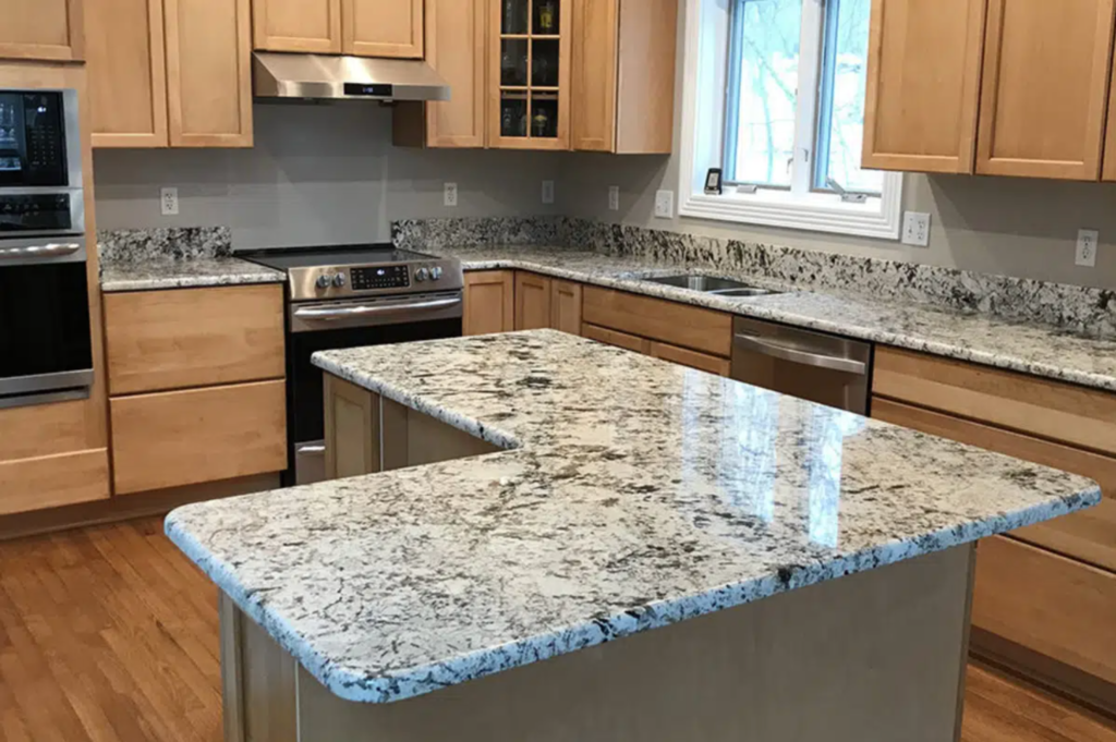 Professional kitchen countertop installation featuring a custom quartz surface