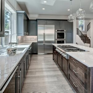 Close-up of quartzite countertops and refaced shaker cabinets in a minor kitchen remodel, highlighting high-return investments.